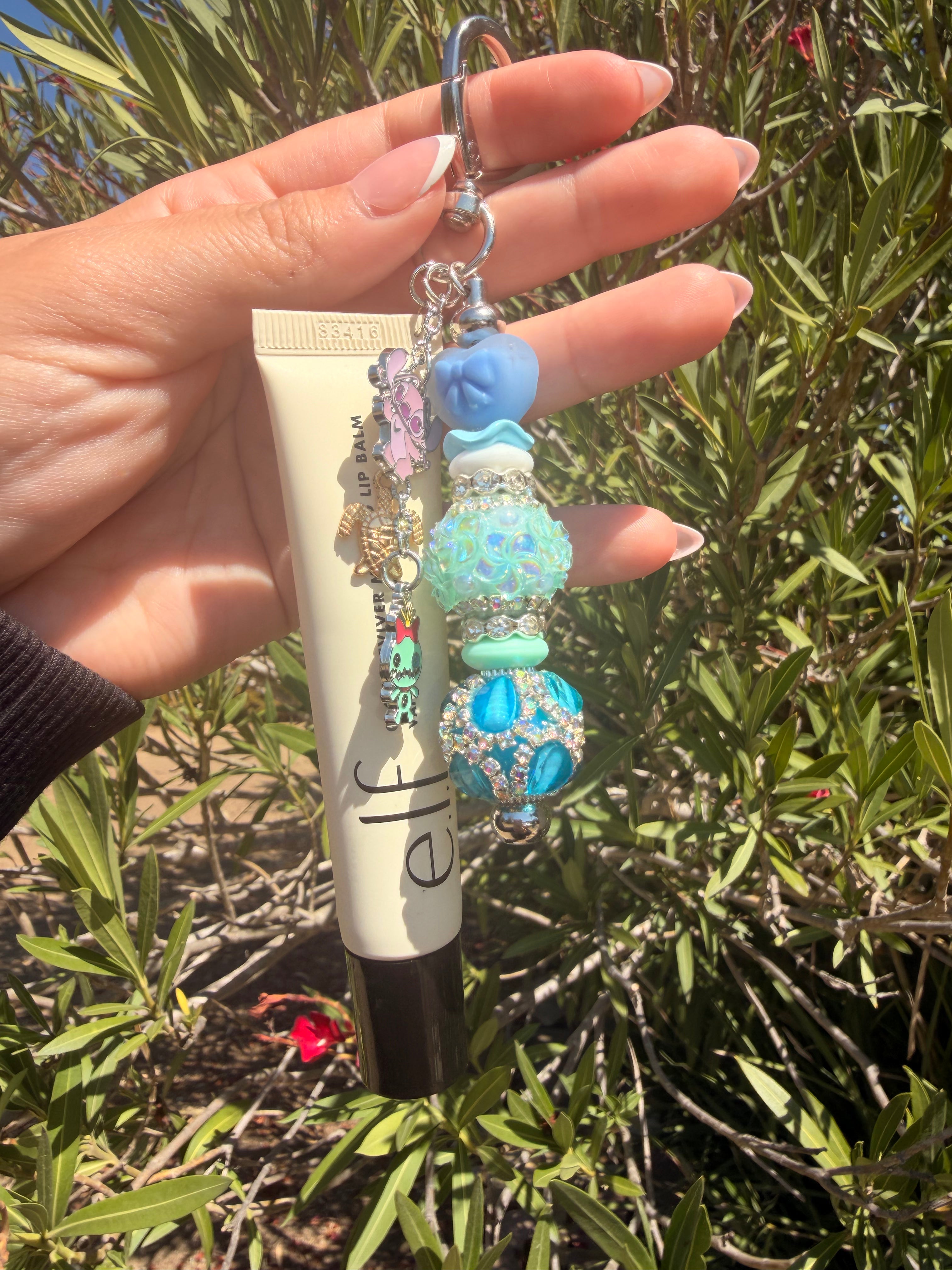 Large elf lip balm keychain